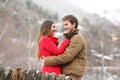 Happy couple hugging in winter holiday