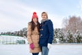 Happy couple ice skating on rink outdoors Royalty Free Stock Photo