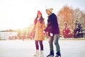 Happy couple ice skating on rink outdoors Royalty Free Stock Photo