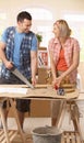 Happy couple improving new house Royalty Free Stock Photo