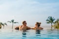 Happy couple in infinity pool Royalty Free Stock Photo