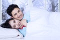 Happy couple jest on bed Royalty Free Stock Photo