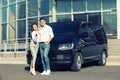 Happy couple with key near car on street. Buying new auto Royalty Free Stock Photo