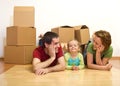 Happy couple with a kid in their new home Royalty Free Stock Photo