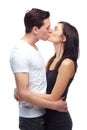 Happy couple, kiss and hug with love in studio mockup, romance and care in committed relationship for bonding. Young man