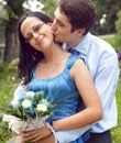 Happy couple in a kiss and hug romantic moment Royalty Free Stock Photo