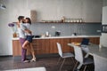 Couple kissing in the morning while making breakfast. Love, Romance and valentineÃ¢â¬â¢s day concept Royalty Free Stock Photo