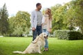 Happy couple with labrador dog walking in city Royalty Free Stock Photo