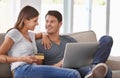 Happy couple, laptop and sofa with credit card for online shopping, payment or purchase in living room at home. Man and Royalty Free Stock Photo