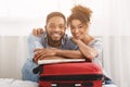 Happy couple leaning on suitcase, preparing for vacation Royalty Free Stock Photo