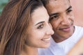 Happy couple looking away and admiring something interesting. Close up of romantic young couple spending leisure time outdoors. Royalty Free Stock Photo