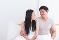 Happy couple looking at each other on bed Royalty Free Stock Photo