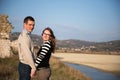 Happy couple in love on engagement day in natural park. Royalty Free Stock Photo