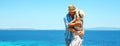 Happy couple in love on hats on the beach Royalty Free Stock Photo