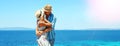 Happy couple in love on hats on the beach Royalty Free Stock Photo