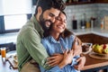 Happy couple in love having fun in kitchen at home Royalty Free Stock Photo