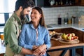 Happy couple in love having fun in kitchen at home Royalty Free Stock Photo