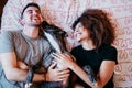 happy couple in love at home. Afro american woman, caucasian man and their pit bull dog together. Family concept Royalty Free Stock Photo