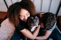 happy couple in love at home. Afro american woman, caucasian man and their pit bull dog together. Family concept Royalty Free Stock Photo