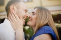 Happy couple in love hugging and kissing on the street old town. Royalty Free Stock Photo