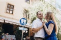 Happy couple in love hugging and kissing on the street old town. Royalty Free Stock Photo