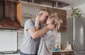 happy couple in love kissing in the kitchen smeared in flour Royalty Free Stock Photo