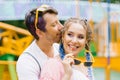 Happy couple in love kissing in an outdoor amusement park during leisure time Lifestyle concept of young people Royalty Free Stock Photo