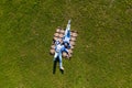 Happy young couple in love lying in the park together on blanket from above, Aerial view Royalty Free Stock Photo