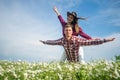 happy couple in love of man and woman in summer chamomile flower field, having fun Royalty Free Stock Photo