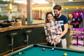 Happy couple playing snooker Royalty Free Stock Photo