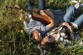 Happy couple in love on a romantic date at the park on a picnic. Playing on a guitar and having fun outdoors. Top view Royalty Free Stock Photo