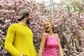 Happy couple in love in spring magnolia flowers Royalty Free Stock Photo