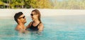 happy couple in love swimming in the ocean by tropical white sand beach. romantic getaway. banner with copy space Royalty Free Stock Photo