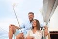 Happy couple in love taking selfie on sailing boat, relaxing on a yacht at the sea. Royalty Free Stock Photo