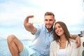 Happy couple in love taking selfie on sailing boat, relaxing on a yacht at the sea. Royalty Free Stock Photo