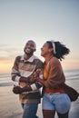 Happy couple, love and travel at the beach holding hands on date, quality time and romance at sunset. Black woman and Royalty Free Stock Photo