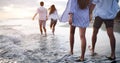 Happy couple in love walking on beach, enjoying summer vacation Royalty Free Stock Photo