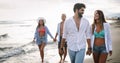 Happy couple in love walking on beach, enjoying summer vacation Royalty Free Stock Photo