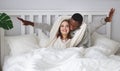 Happy couple in love on winter morning in bed Royalty Free Stock Photo