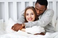 Happy couple in love on winter morning in bed Royalty Free Stock Photo