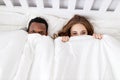 Happy couple in love on winter morning in bed Royalty Free Stock Photo