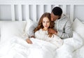 Happy couple in love on winter morning in bed Royalty Free Stock Photo