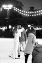 Happy couple of lovers having fun hugging an kissing at ice skating rink outdoor. St. Valentines Day Royalty Free Stock Photo