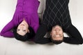 Happy couple lying down on floor Royalty Free Stock Photo