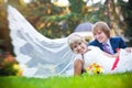 Happy couple are lying on the green grass Royalty Free Stock Photo