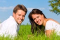 Happy couple lying on a meadow Royalty Free Stock Photo