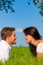 Happy couple lying on a meadow Royalty Free Stock Photo