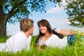 Happy couple lying on a meadow Royalty Free Stock Photo