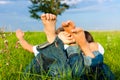 Happy couple lying on a meadow Royalty Free Stock Photo