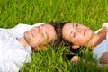 Happy couple lying on a meadow Royalty Free Stock Photo